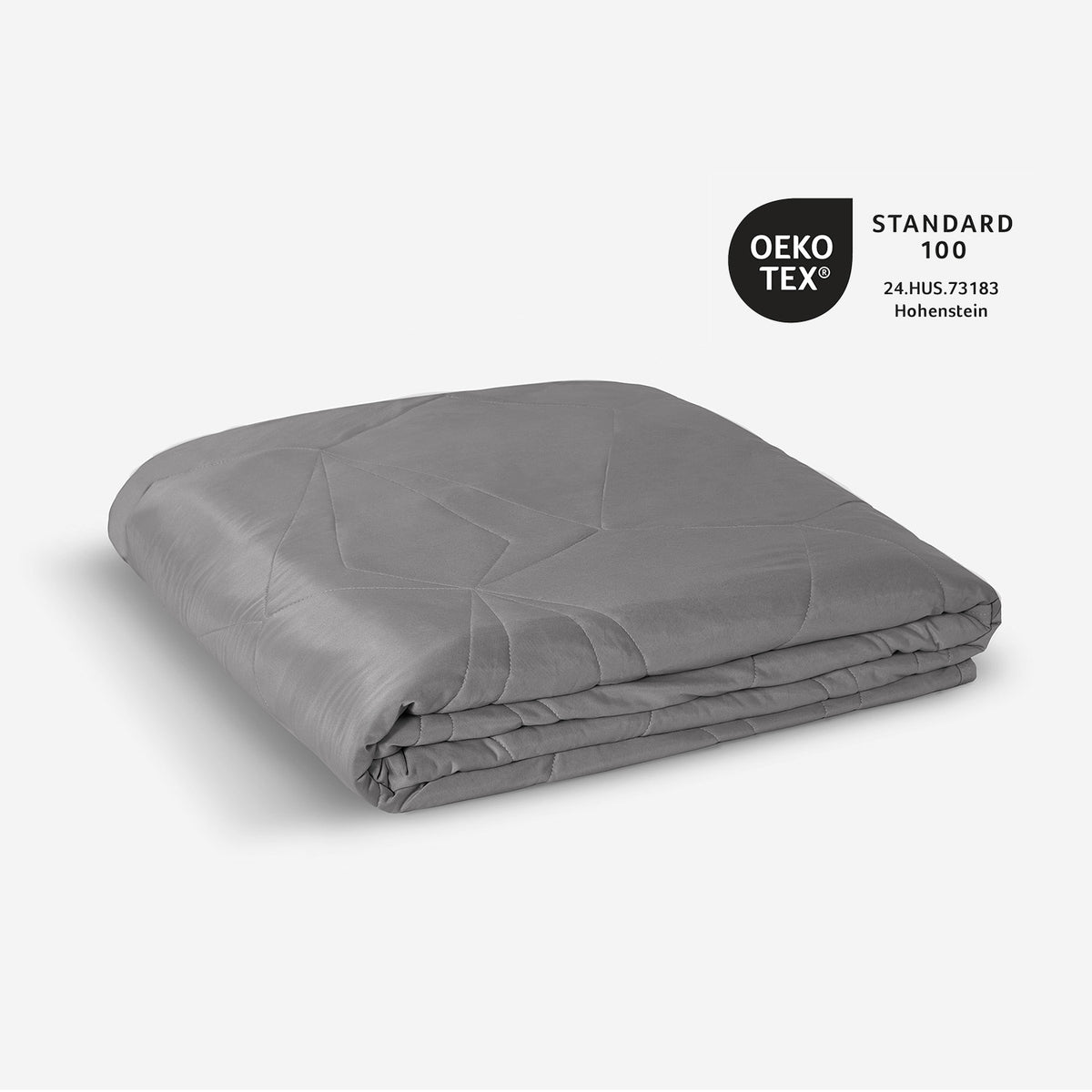A neatly folded stack grey of BEDGEAR bedding is displayed.