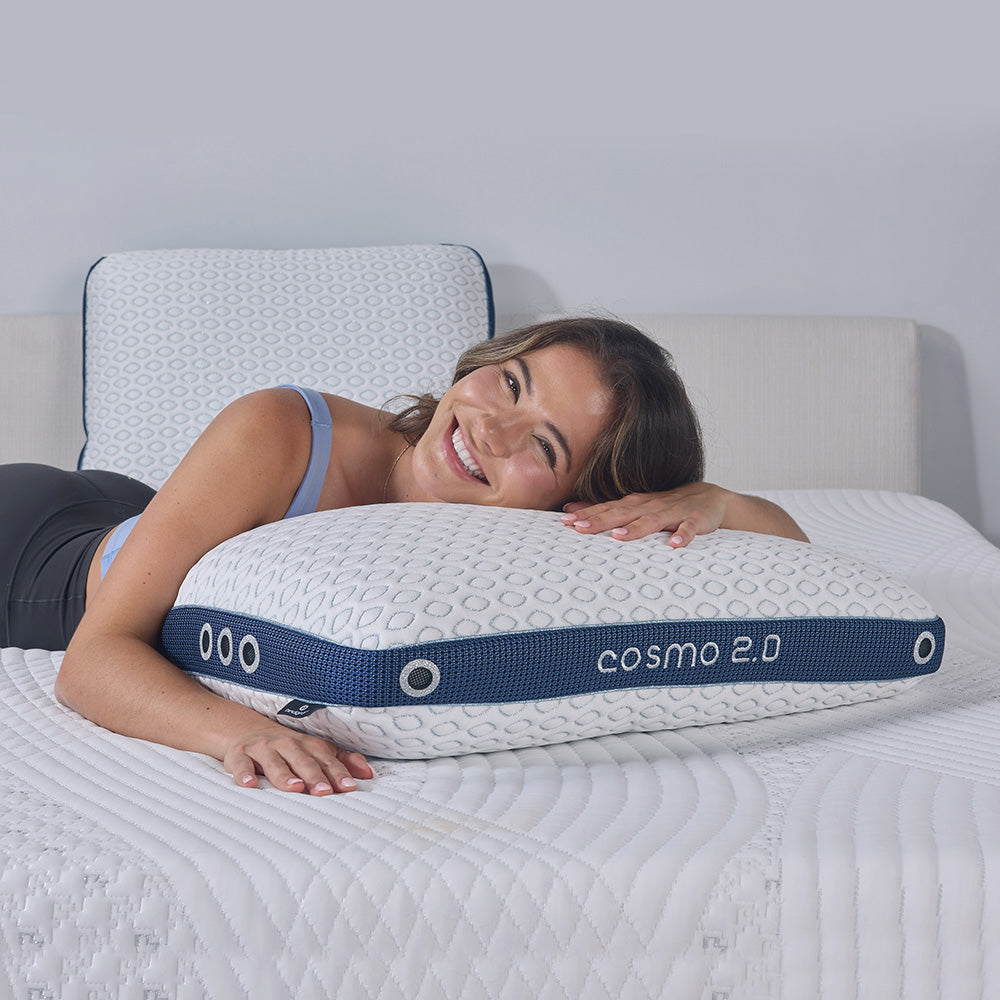 A woman sleeping on the Cosmo 2.0; one of the best pillows for back sleepers. 