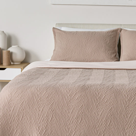 Decorative pillows on a BEDGEAR mattress. 