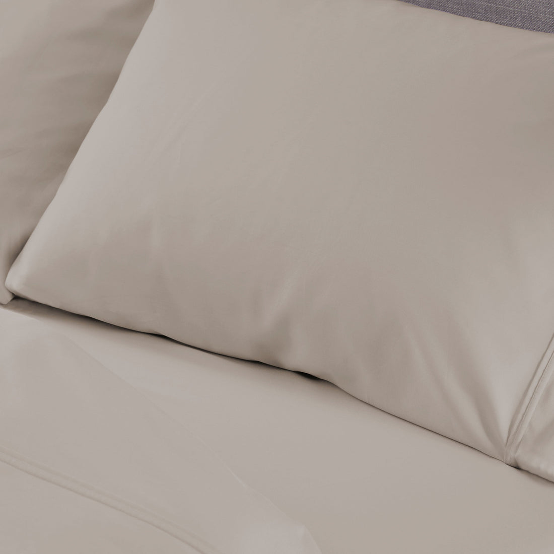 A bed sheet and pillowcase on a bed. 