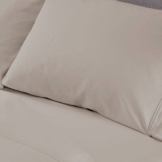 A bed sheet and pillowcase on a bed. 
