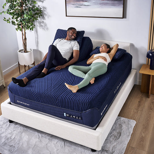 A happy couple on a split king mattress.
