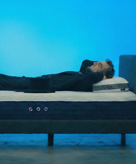 A man sleeping comfortably on the right mattress size.