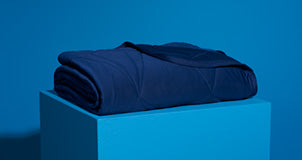 A performance cooling blanket on a pedestal.