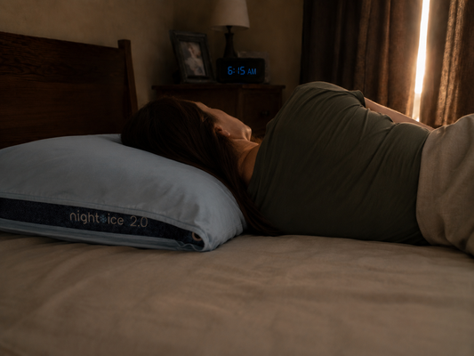 A woman sleeping after learning, "Can your pillow help reduce snoring?"