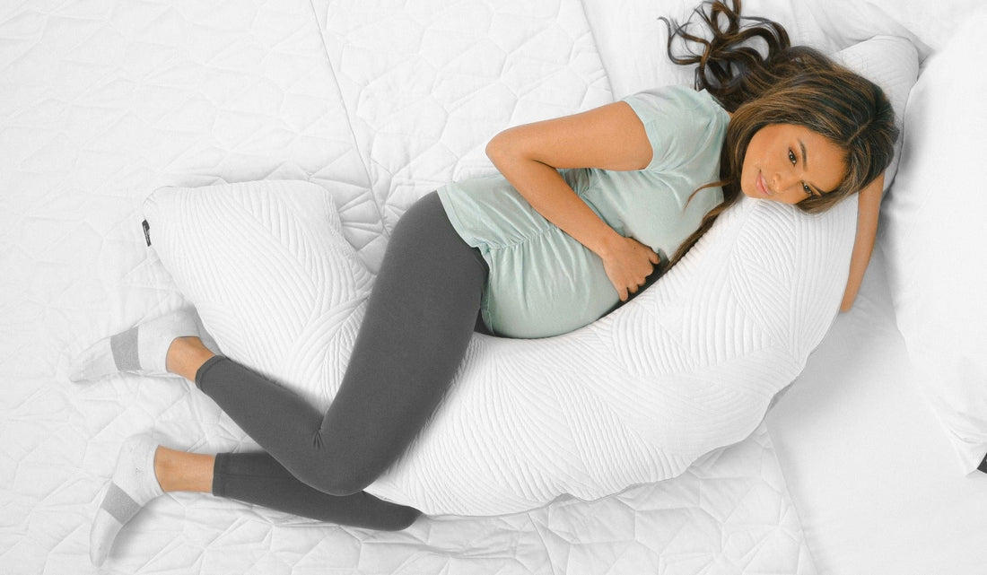 A woman sleeping on BEDGEAR's body pillow.