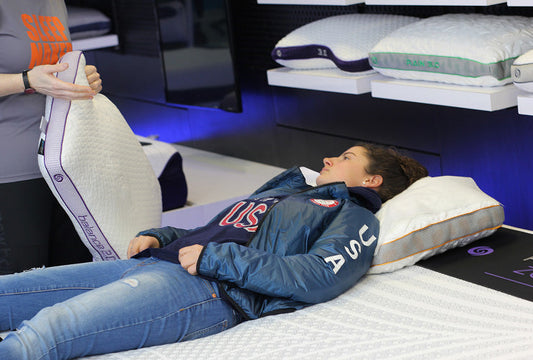 A woman with a sleep coach learning more about sleep quality vs. quantity. 
