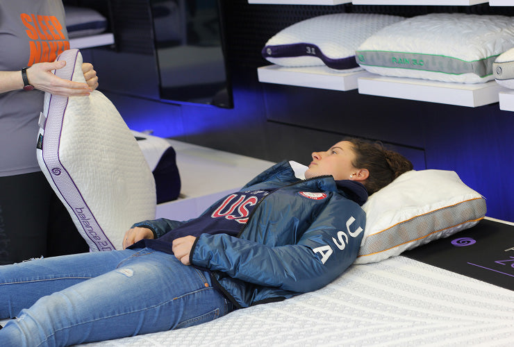 A woman with a sleep coach learning more about sleep quality vs. quantity. 