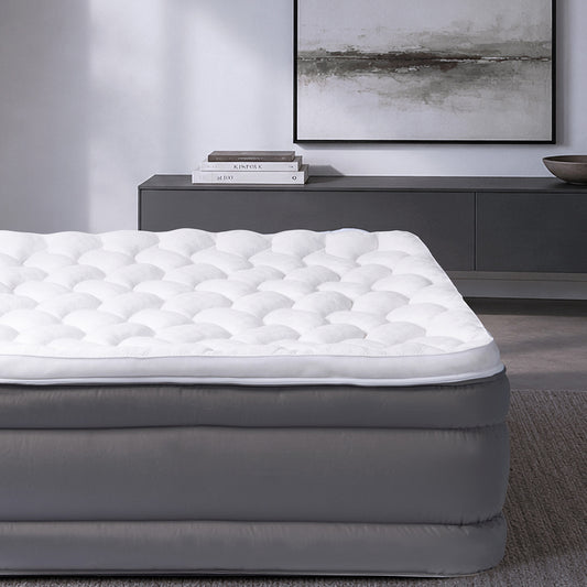 A queen size air mattress in a bedroom "Queen"