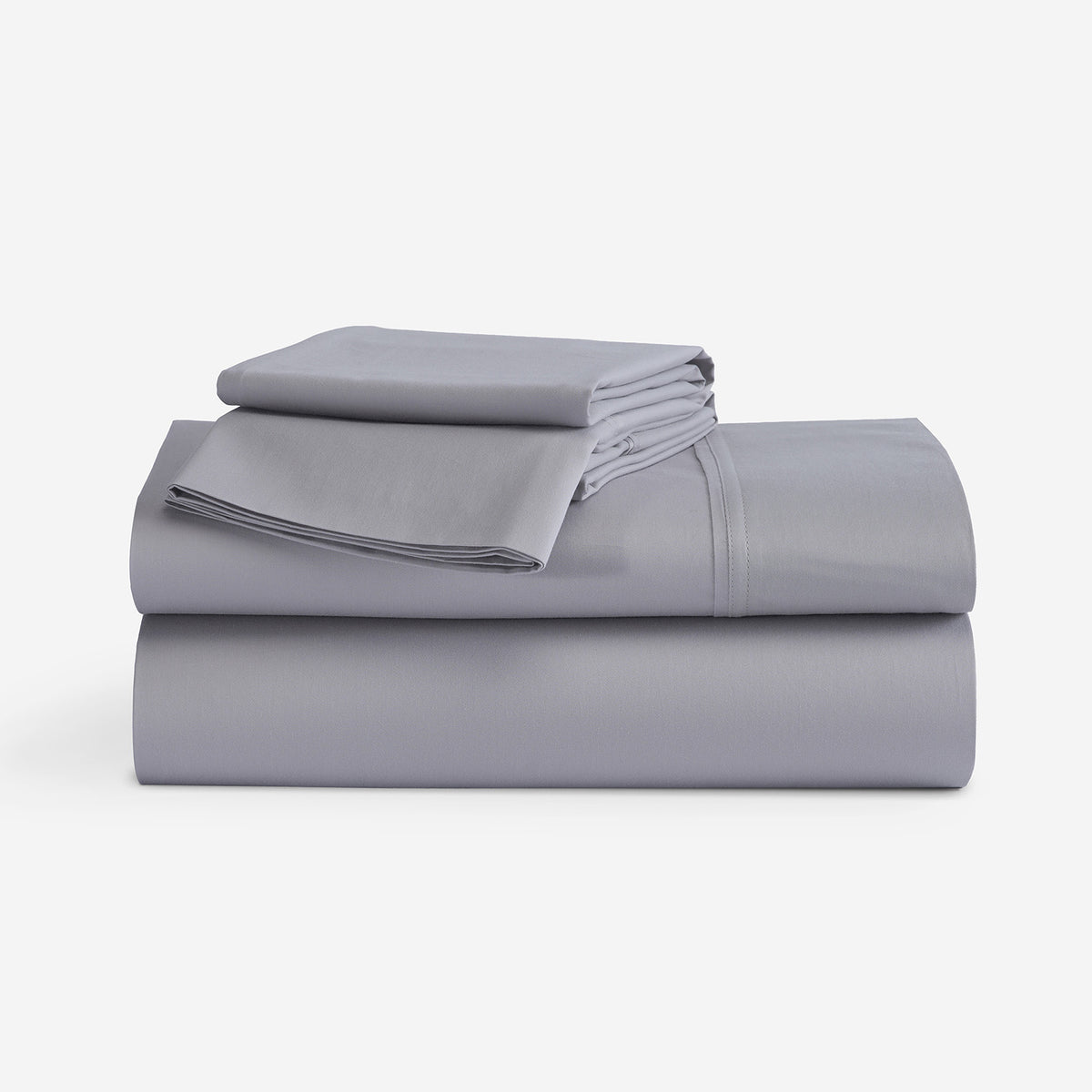 A stack of folded gray bedding, including a folded sheet and folded pillowcases, displayed on a clean white background.