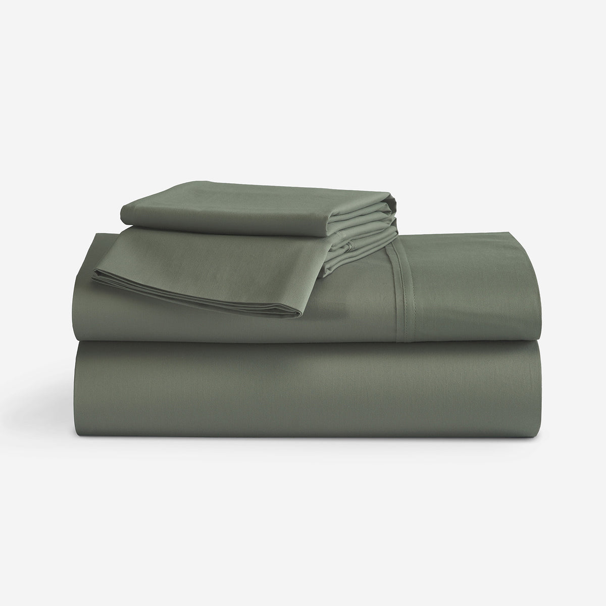 A stack of folded bedding sheet set, in a solid moss green color, photographed on a clean white studio background.