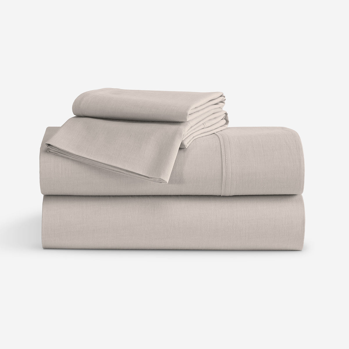 A stack of  folded sheets in a light taupe-beige color, displayed on a clean white background.