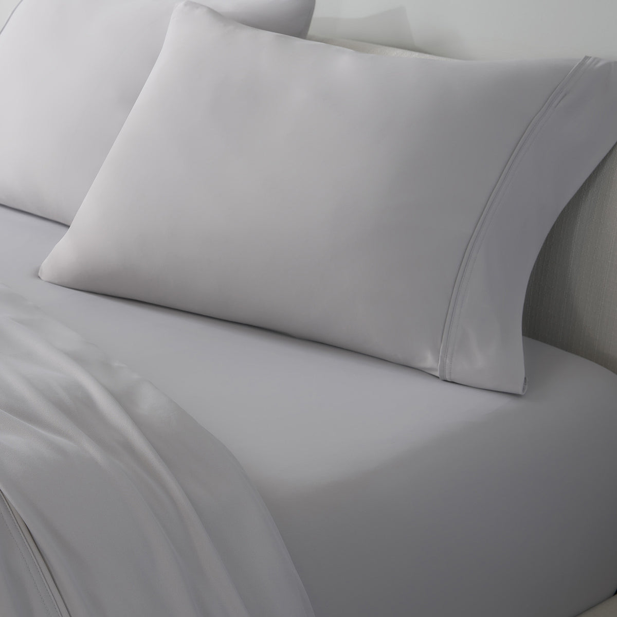 An image of light grey VerTex sheets and pillowcases.
