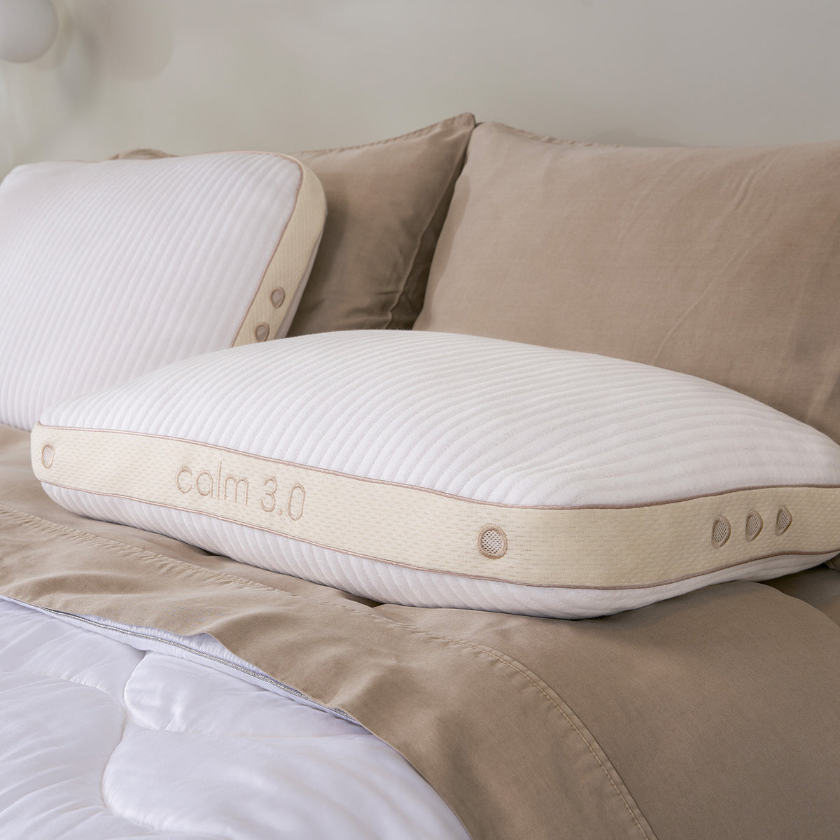 Close-up of two calm performance pillows on a bed.