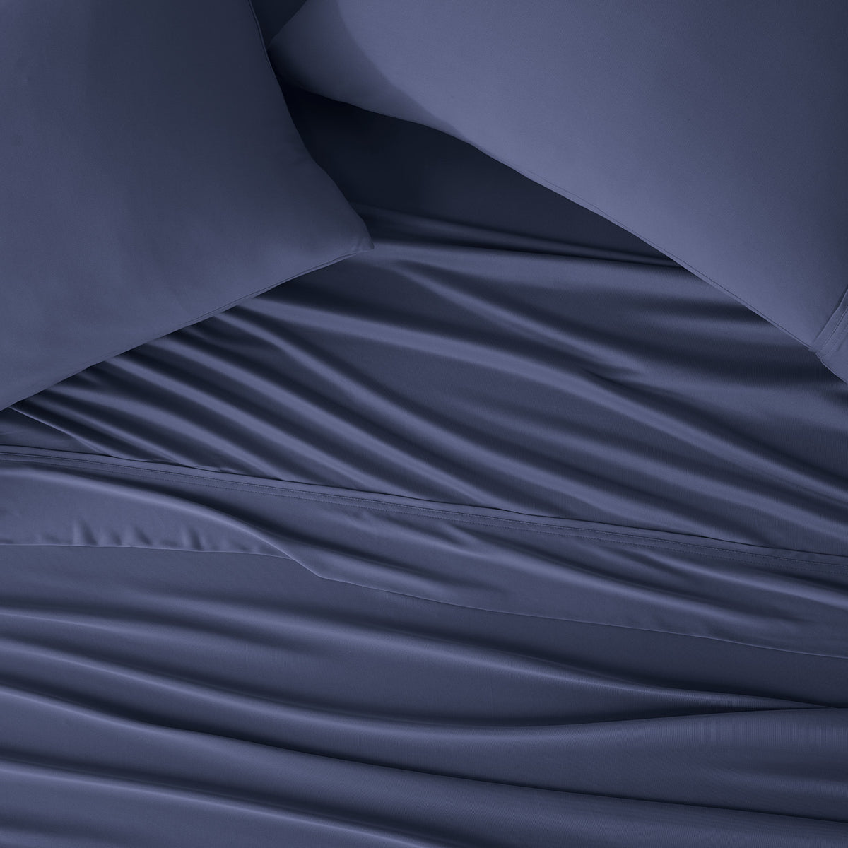 Flowing navy DriTec sheets and pillowcases.