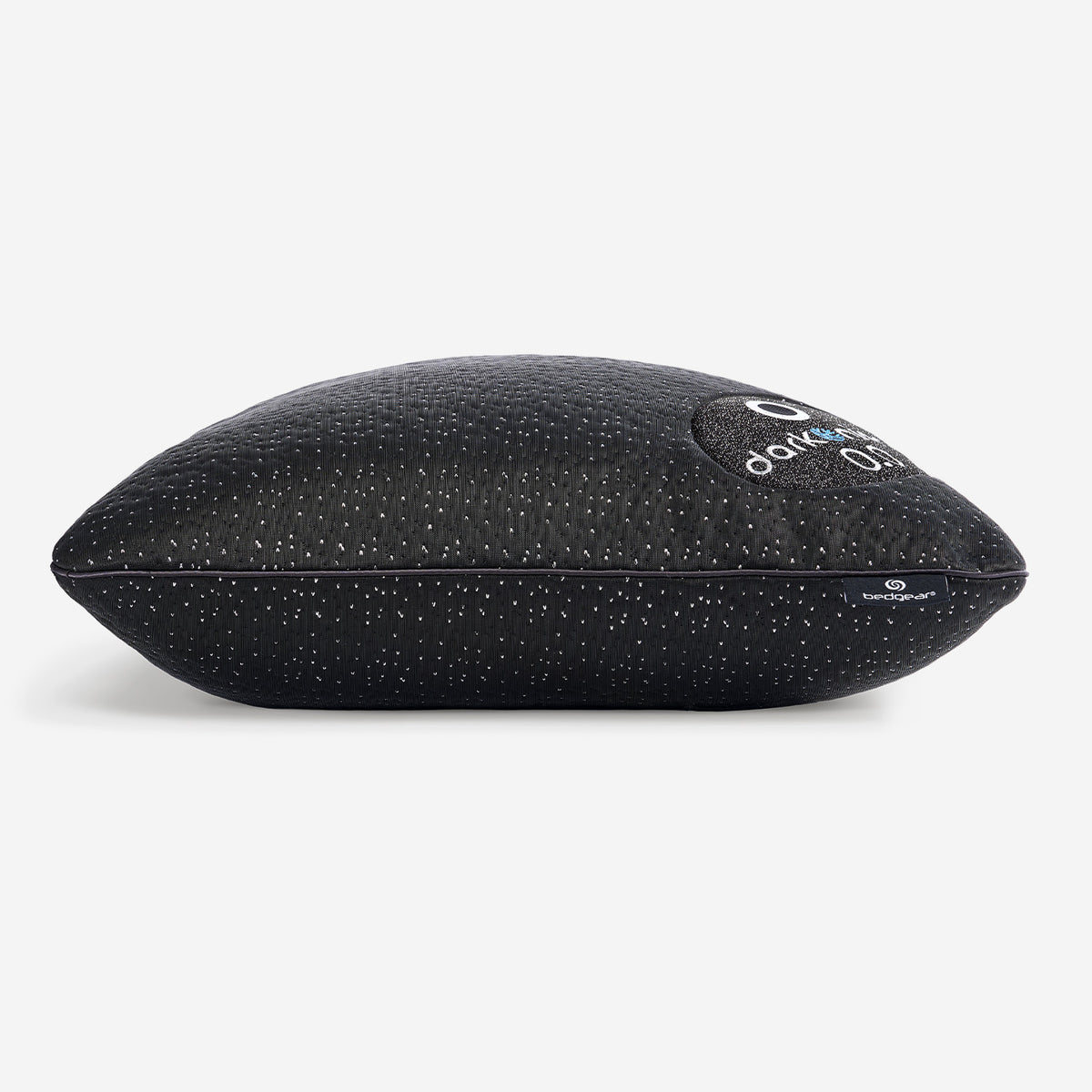 A profile view of the dark night pillow, shown on a white background.