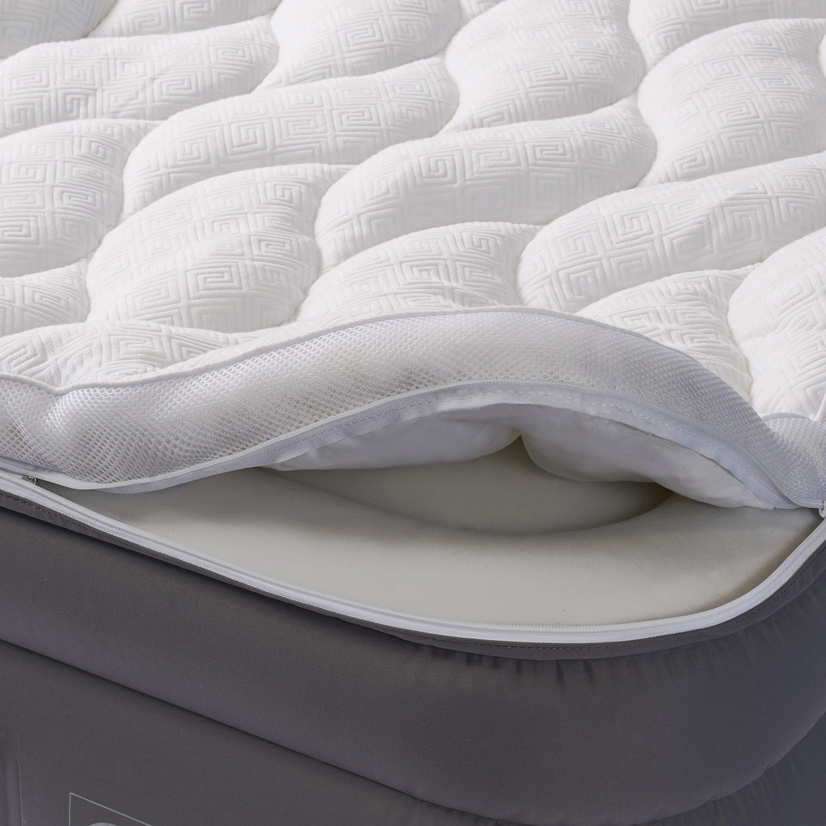 Close-up of zip off pillow top on air mattress.