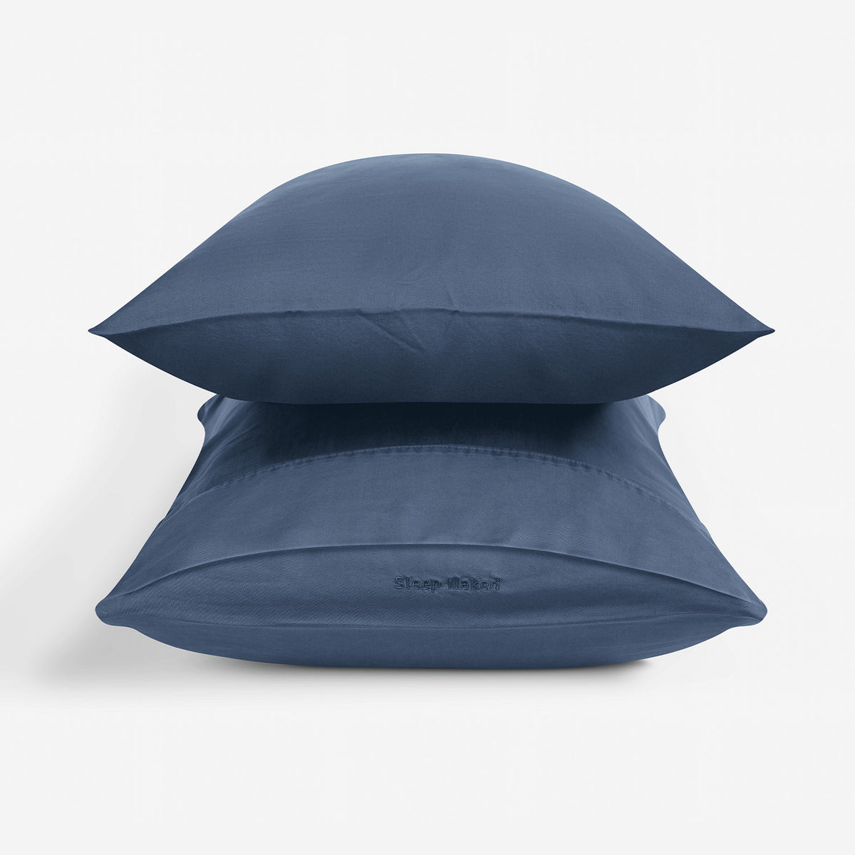 Two indigo blue pillowcases stacked on a white background.