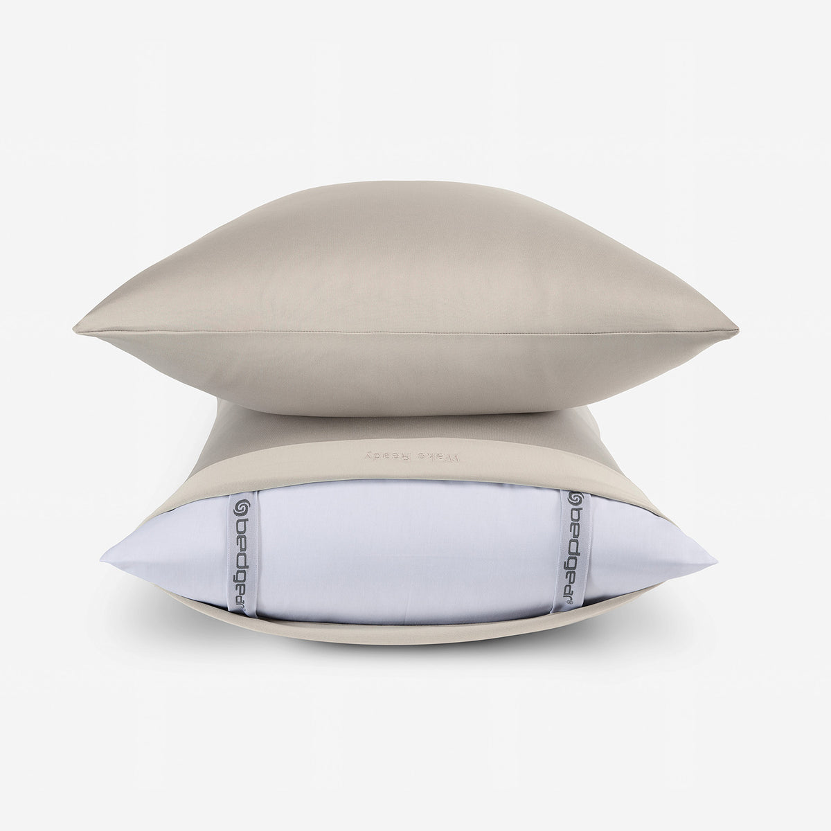 Two DriTec pillowcases stacked in tan.