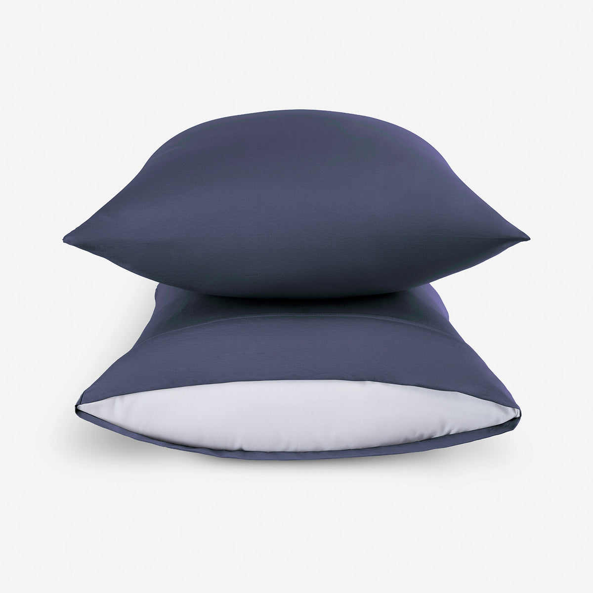 Two stacked essential pillowcases covering pillows.