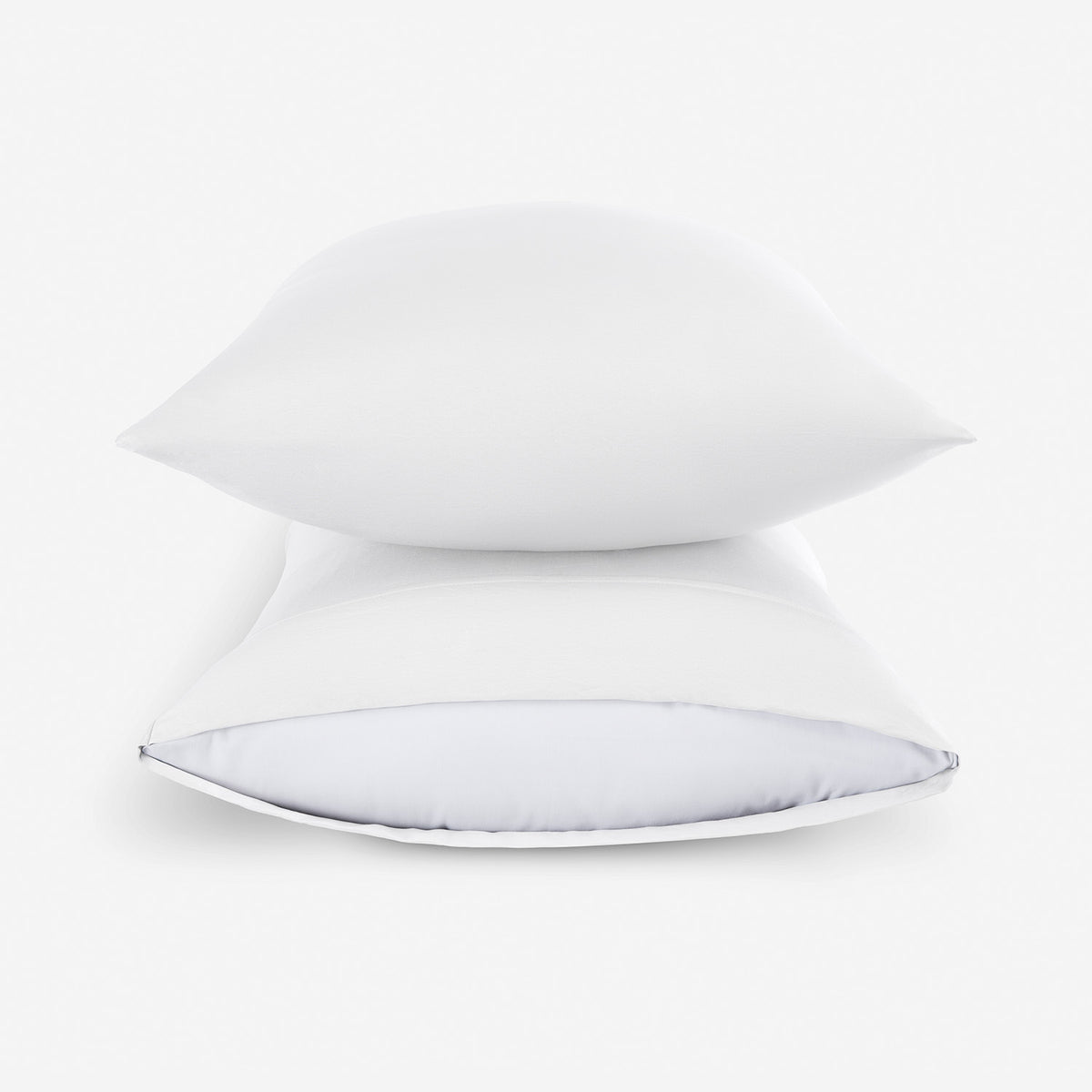 Two essential pillowcases stacked on pillows.